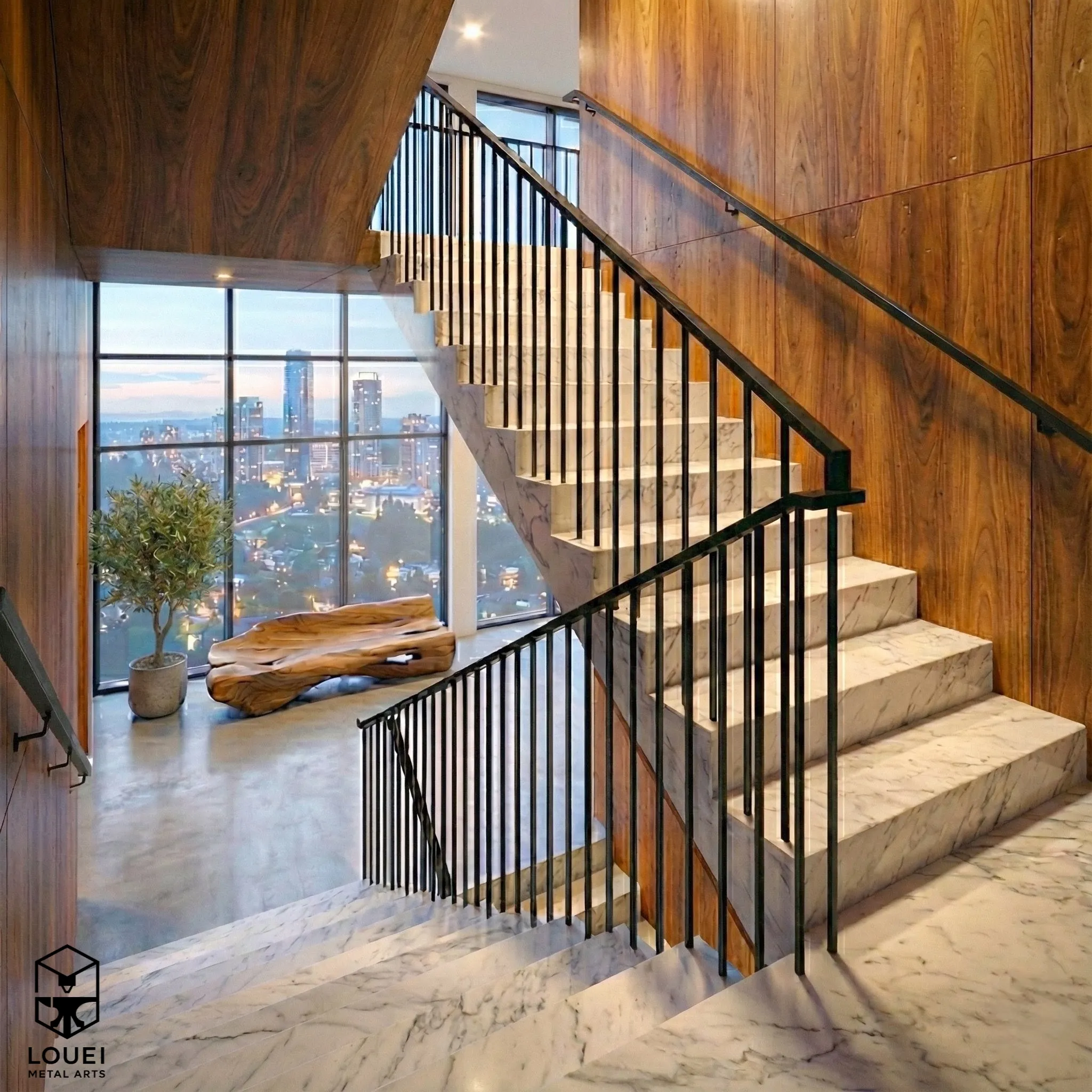 Black picket stair railing on marble staircase overlooking Vancouver skyline