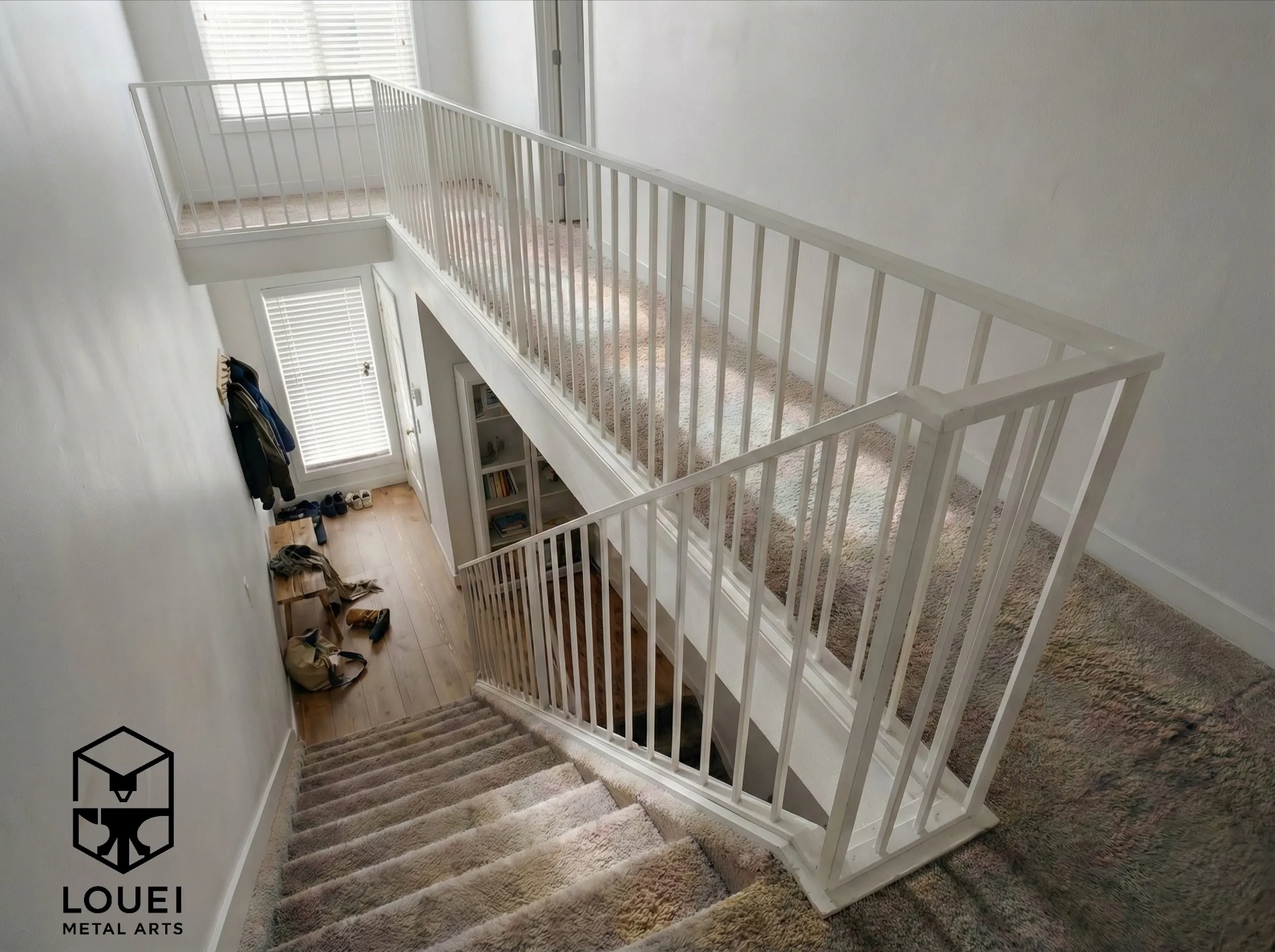 White metal picket stair railing in a bright Vancouver townhome