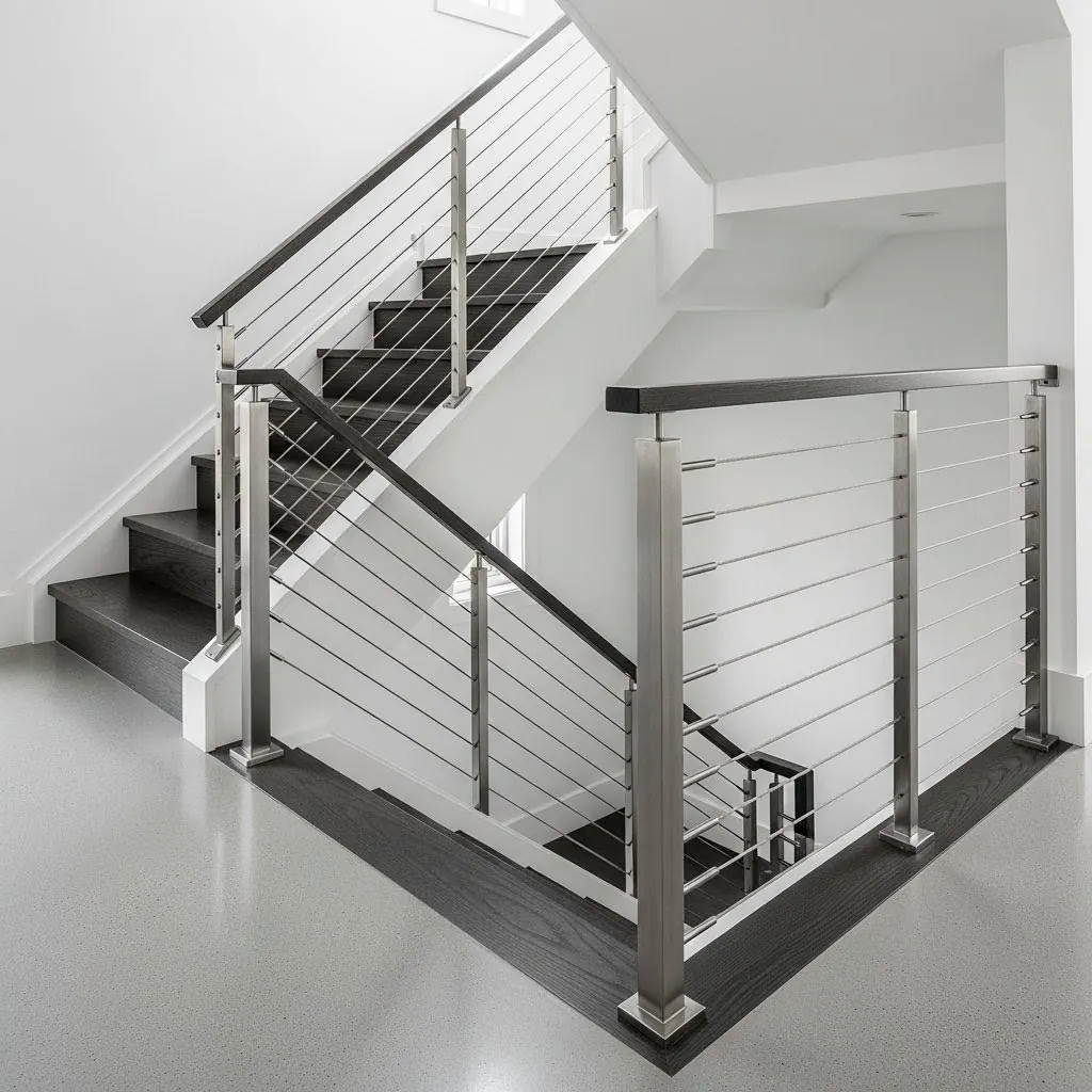 Interior switchback stair with stainless cable railing — visible from above, below, and the landing, showing how sightlines change with angle by LOUEI Metal Arts