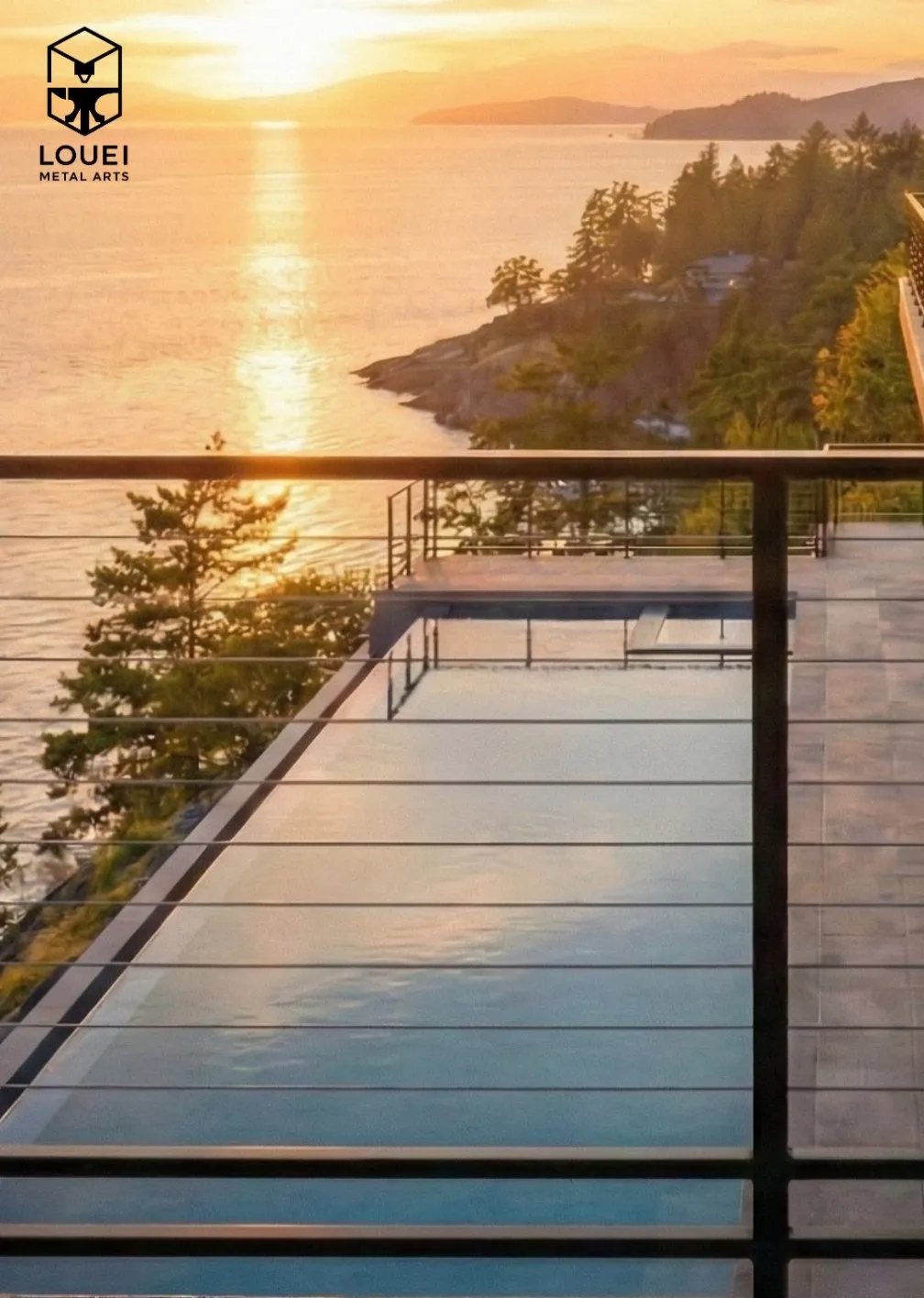 Exterior cable railing beside an infinity pool overlooking the ocean at sunset.